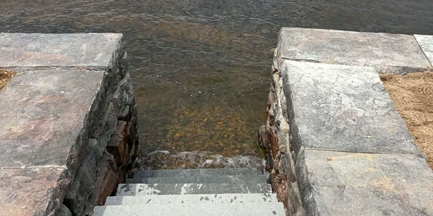 Finished stone steps into the lake
