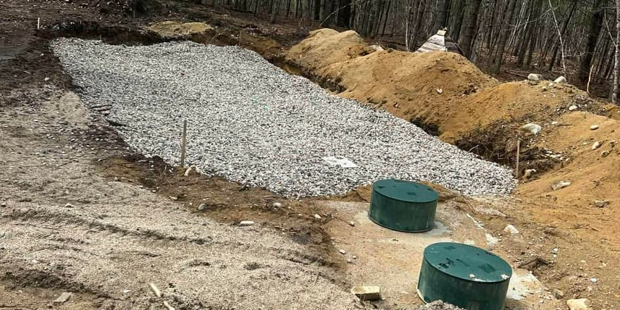 Septic leach field and risers being installed
